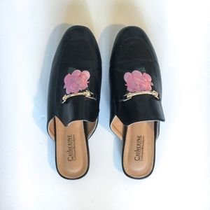 Black slip on with embroidered pink rose.